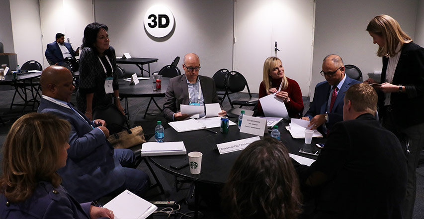 Liz Sara, a Dingman Angel (standing left) and Holly DeArmond, Interim Managing Director of Dingman Center of Entrepreneurship (standing right) moderated the judges’ deliberation.