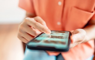 Woman browsing online store with wide variety of products available.